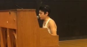 Watch A Kid’s Bohemian Rhapsody Performance In Front Of Whole School