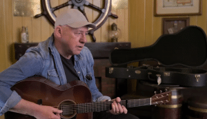 Watch Mark Knopfler Make Brian Johnson Almost Cry When He Plays “Matchstick Man”