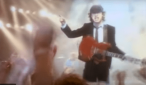 The Story Of Why Angus Young Wears A Schoolboy Uniform