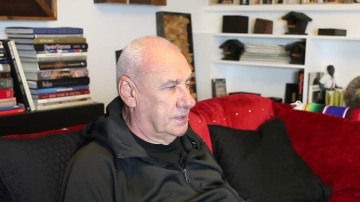 Bill Ward sitting in a couch for an interview