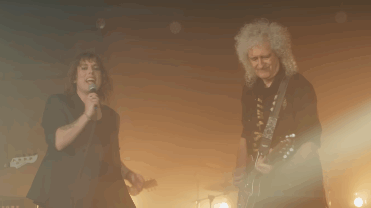 Brian May performing on guitar alongside The Struts’ Luke Spiller in the music video for their 2025 re-recording of “Could Have Been Me.”