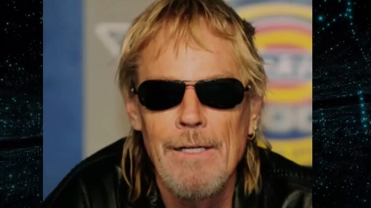 ZZ Top drummer Frank Beard wearing sunglasses and a leather jacket.