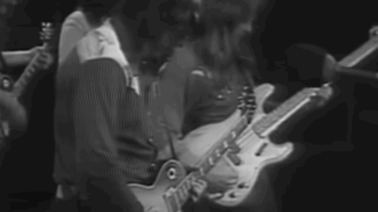 Members of The Marshall Tucker Band performing live on stage in the 1970s, featuring guitars and classic Southern rock instrumentation.