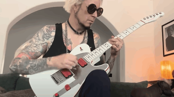 John 5 playing a white Telecaster-style electric guitar during a relaxed home performance session.