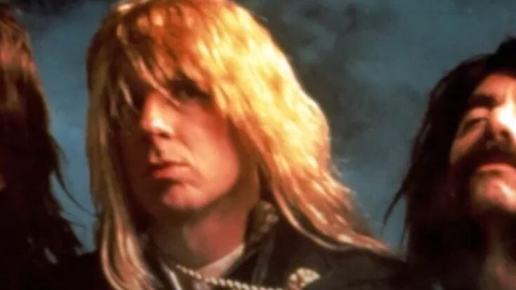 Members of the fictional rock band Spinal Tap posing in their classic 1980s look, from the mockumentary This Is Spinal Tap.