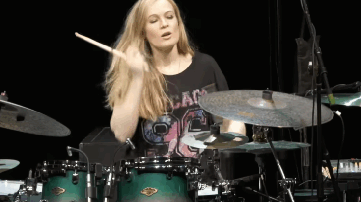 Anika Nilles performing an energetic drum solo during the Drumeo Festival, showcasing her precise technique and dynamic stage presence.